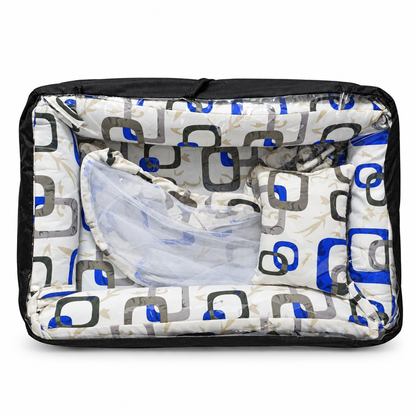 Co-sleeper in teal and gold wave print, packaged