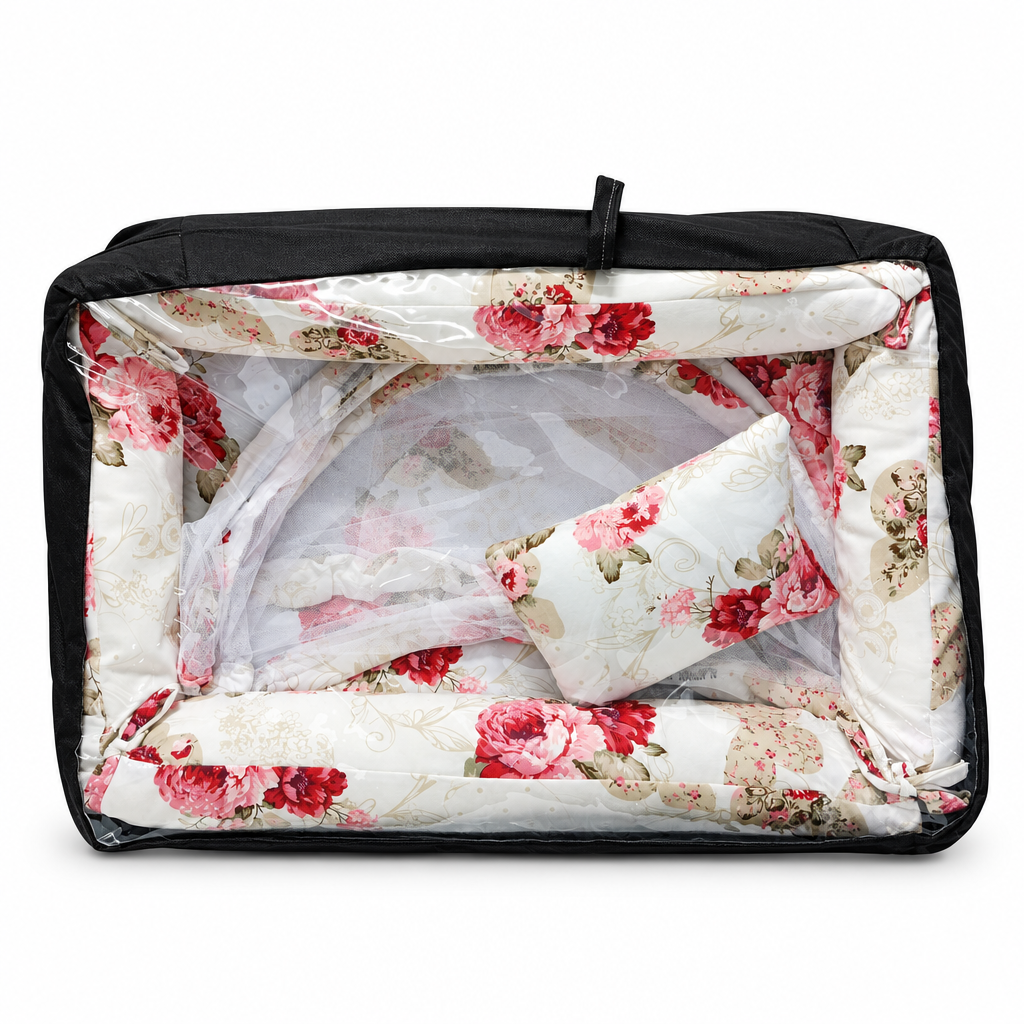 Co-sleeper in white and orange geometric print, packaged