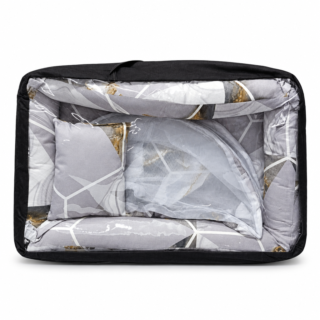 Co-sleeper in blue and white leaf print, packaged